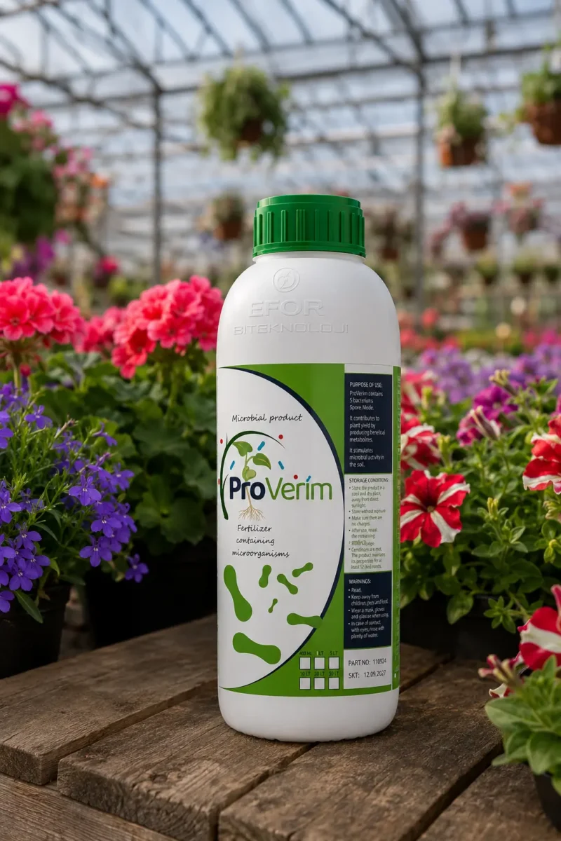 ProVerim Microbial BioFertiliser 1L bottle on a potting bench in a UK flower nursery greenhouse