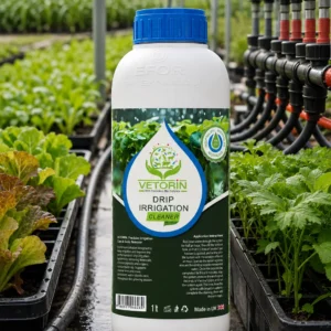 Damlama2 ProVerim Drip Irrigation Cleaner bottle beside seedling trays in a commercial nursery greenhouse